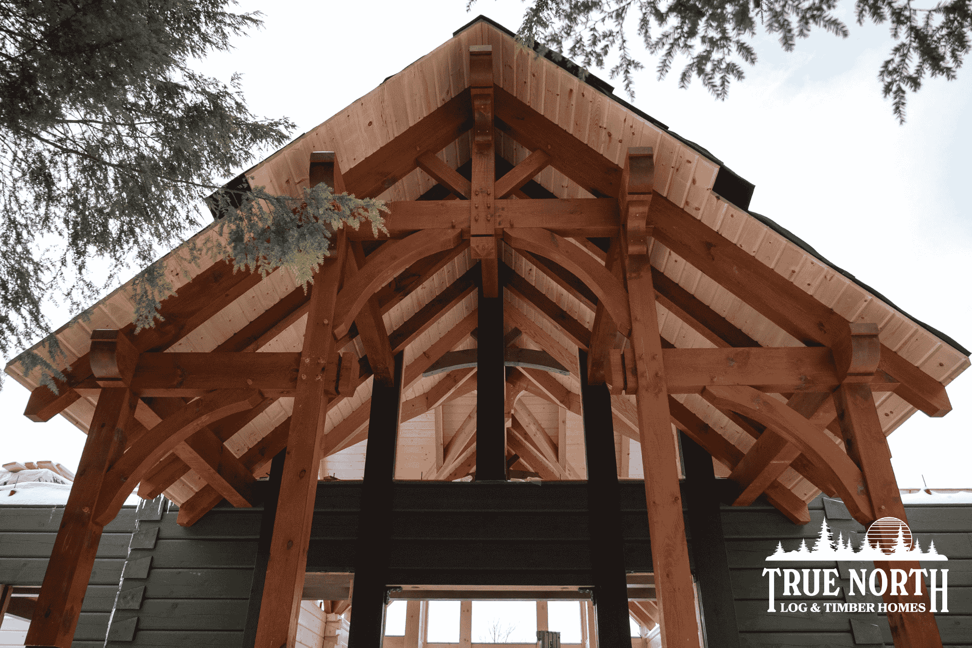 The stunning timber frame entrance to a 10,000 sq. Ft. log and timber home under construction in Sudbury, Ontario.